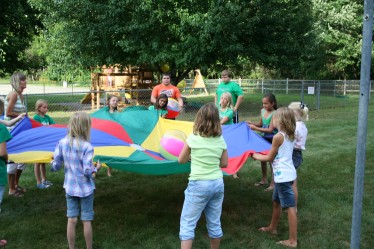 Children Holding Parachute