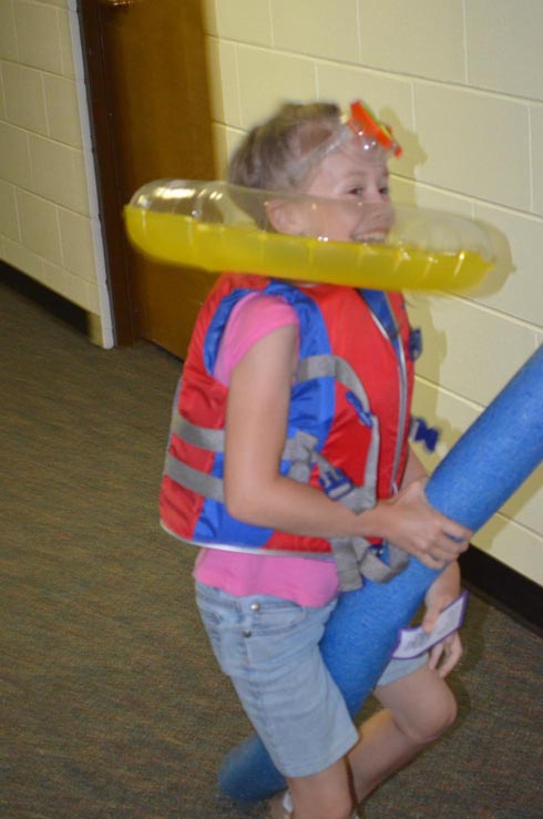 Girl Dressed with Float Ring, Goggles & Life Vest